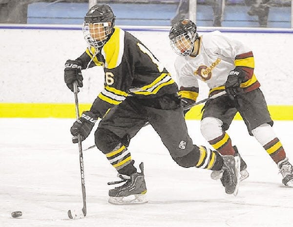 Nauset's Cam McPartland, left, had the lone goal for the Warriors in their 5-1 loss to Dennis-Yarmouth on Sunday.