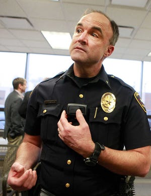 Lubbock Police Assistant Chief Jerry Brewer demonstrates how one of the 70 donated body cameras work at the Lubbock Police Department Monday. (Stephen Spillman / AJ Media)