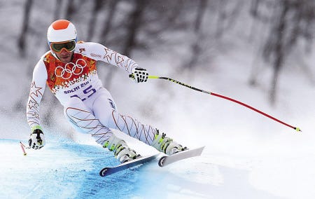 Skier and New Hampshire native Bode Miller makes a turn during the men’s downhill at the Winter Olympics on Sunday in Krasnaya Polyana, Russia.