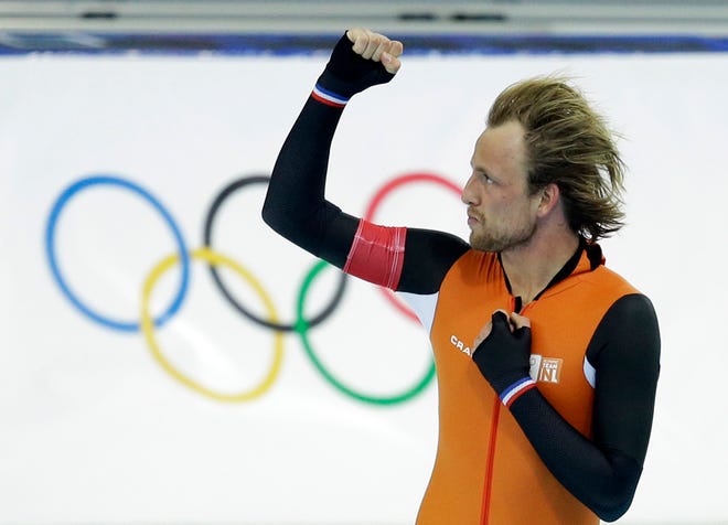 Gold medallist Michel Mulder from the Netherlands clenches his fist after his second heat race in the men's 500-meter speedskating race at the Adler Arena Skating Center during the 2014 Winter Olympics on Monday in Sochi, Russia.