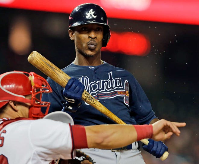 FILE - In this Aug. 6, 2013 file photo, Atlanta Braves' B.J. Upton reacts after a called third strike during the ninth inning of a baseball game against the Washington Nationals at Nationals Park in Washington. Spring training is Upton's chance for a fresh start after hitting .184 and losing his starting job in his Atlanta debut. (AP Photo/Alex Brandon, File)
