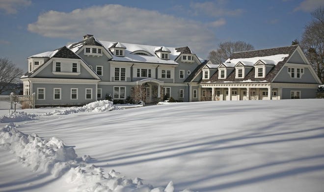 A large mansion on Hingham Harbor at 5 Bare Cove Lane sold for $7.1 million. Monday Feb.10, 2014.