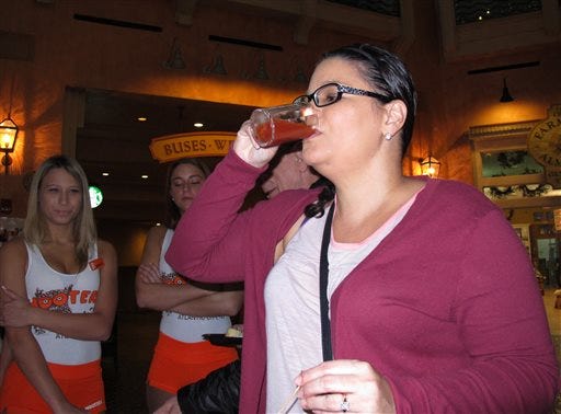 Nadina Fornia, of Egg Harbor Township, N.J., tastes a bloody Mary mixed with bacon-flavored beer at the Tropicana Casino and resort in Atlantic City, N.J. on Monday.