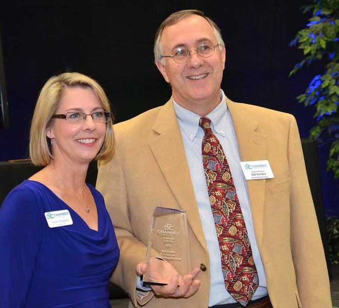 Bob Kendra, of Kendra Financial Group, who received the Ambassador of the Year award, stands next to chamber CEO Tammy Shepherd.