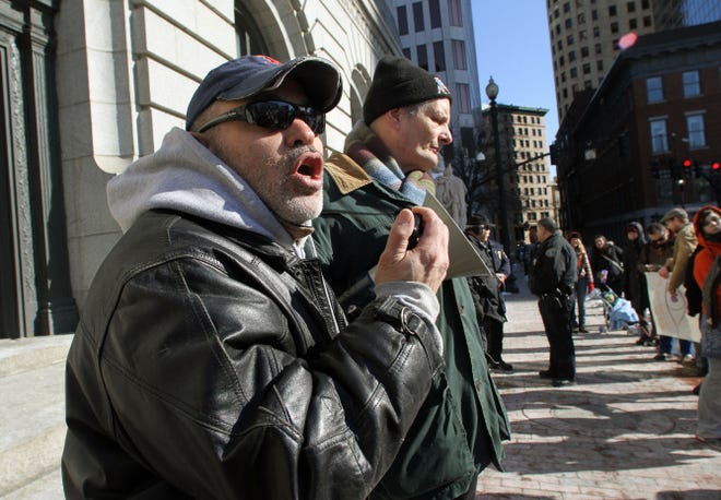 Robert Scott Perry, of Portsmouth, speaks Tuesday at a rally against government surveillance. The protest, in front of the Federal Building in Providence, was organized by Rhode Island MoveOn.org and the R.I. Coalition to Defend Human and Civil Rights, and was part of a national effort.