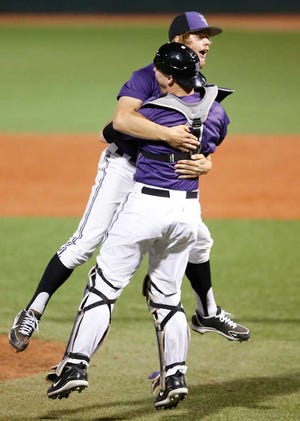 Kansas State pitcher Jake Matthys celebrates with catcher Blair Debord after the final pitch in the win over Arkansas in an NCAA baseball regional game in Manhattan, Kan., Sunday, June 2, 2013. (AP Photo/Jeff Tuttle)