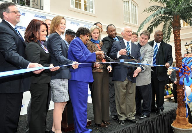 Area mayors along with airport and business leaders cut the ribbon to celebrate the inaugural Jet Blue flight to Savannah/Hilton Head International. -Steve Bisson/Savannah Morning News