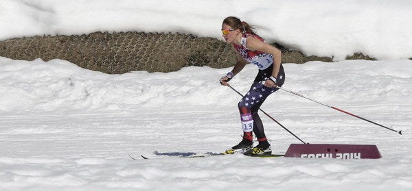 United States' Sophie Caldwell skis with a sleeveless top as temperatures during the women's 10K classical-style cross-country race at the 2014 Winter Olympics, Thursday, Feb. 13, 2014, in Krasnaya Polyana, Russia.