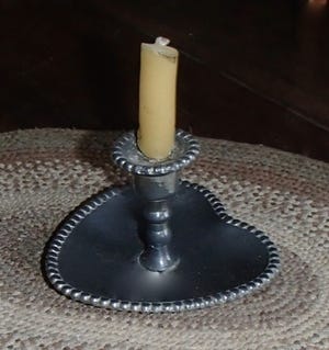 In the mid-1800s, this little 2-inch pewter candleholder was made by a self-taught whitesmith for his lady love. The elderly lady who sold it to me in the early 1970s told me about her grandmother’s beau, a blacksmith by trade. In his off time, he liked to experiment with other metals. The blacksmith didn’t marry her grandmother, but she treasured it because of the story and its beauty. I’m doing the same. Happy Valentine’s Day tomorrow.