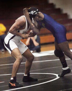 Havelock's Javar Godette and Rocky Mount's tangle in the 145-pound weight class during the first round of the dual state tournament Feb. 4. Godette is a two-seed at this weekend’s 3-A East Regional Wrestling Tournament.