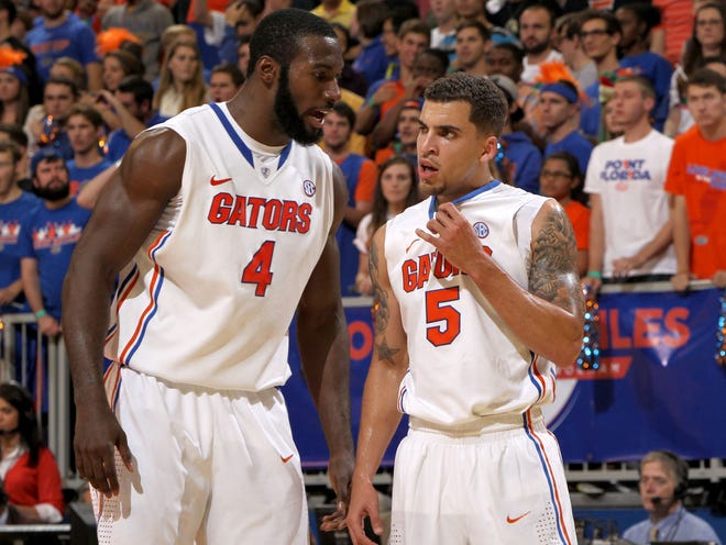 Center Patric Young, left, and point guard Scottie Wilbekin are part of a senior-laden starting lineup that has been crucial to the Gators' run to a No. 3 national ranking this season.