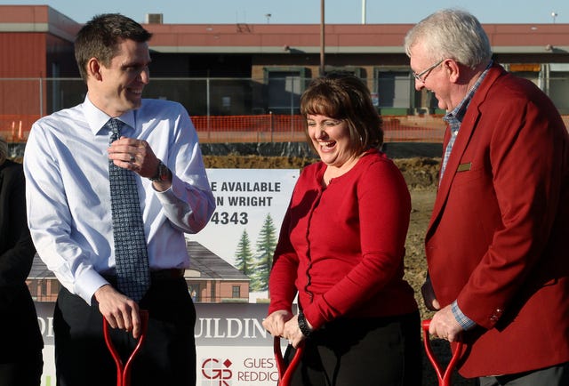 Rachel Rodemann • Times Record / Eric Simpson, IM Well Health COO, from left, Cathy Womack, MD, and Dan Parker CEO, laugh during the groundbreaking ceremony for a new IMWell Health location off 74th Street in Fort Smith, Thursday, Feb. 13, 2014, 
 Rachel Rodemann • Times Record / Dan Parker, IMWell Health CEO, thanks the Fort Smith Regional Chamber of Commerce and visitors for supporting a new facility during a groundbreaking ceremony for the IMWell Health location off 74th Street in Fort Smith, Thursday, Feb. 13, 2014, 
 Rachel Rodemann • Times Record / Jay Kradel, MD, from left, Jacqueline Phillips, APN, Sharon Alt, Vice President of Sales, Eric Simpson, COO, Cathy Womack, MD, and Dan Parker, CEO, pose for a Fort Smith Regional Chamber of Commerce photo during the groundbreaking ceremony for a new IMWell Health location off 74th Street in Fort Smith, Thursday, Feb. 13, 2014,