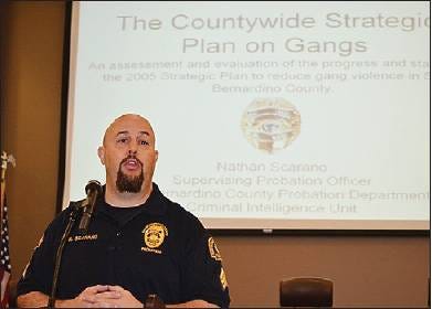 San Bernardino County Probation Department Officer Nathan Scarano speaks during a countywide strategic planning session on gangs this week.