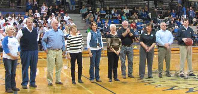 Seniors on the 1964 Oconee County High School basketball teams and cheerleading squads were honored recently. Shown, from left, are Lana Moon Taylor, Ted Wilkes, Bobby Bishop, Debra Mobley McCue, Carol Michael Elder, Elaine Hewell McTyre, school board members Wayne Bagley, Kim Argo, Mark Thomas, and School Superintendent Jason Branch.