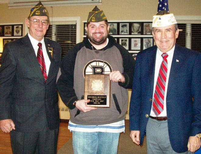 VFW Post 1807 Vice Commander Paul Walsh, past Commander Jeremiah Marcoux, and Post Commander Robert “Ski” Grudziecki share a smile during the third annual awards night as Marcoux gets rec- ognition.