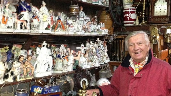 Carleton Varney stands amid an extensive Staffordshire porcelain collection at Tony Honan Antiques in Ennis, in County Clare, Ireland.