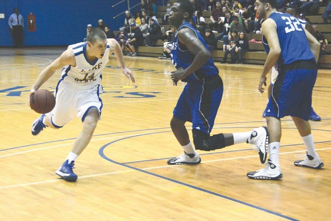 Lake Superior State's Derek Billing drives to the hoop against Grand Valley State Thursday at the Bud Cooper Gym.