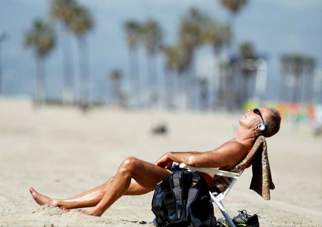Venice Beach resident David Lomax enjoys the warm weather Friday in the Venice Beach area of Los Angeles. With much of the Northeast gripped by snow and ice storms, the Southwest is riding a heat wave.