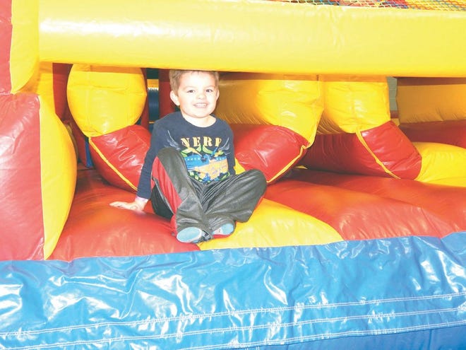Tristan Grover, a five-year-old junior kindergarten student, enjoyed the event’s bouncy house.