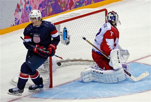 USA forward T.J. Oshie scores a goal in a shootout against Russia during a men's ice hockey game at the 2014 Winter Olympics, Saturday, Feb. 15, 2014, in Sochi, Russia.