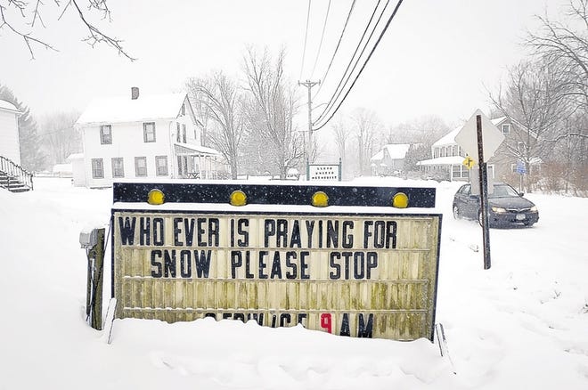 A sign outside the Lloyd United Methodist Church after Thursday's storm sums up many folks' frustration with this winter's weather.