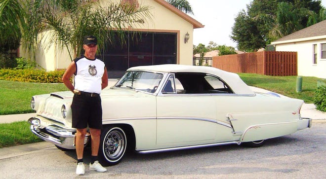 Bob Johnson stands next to his beautiful, fully customized, 1953 Mercury convertible featuring a modern Lincoln 302-V8, custom paint and much more.