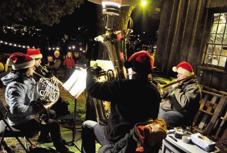 The Portsmouth Brassworks performs during the Candelight Stroll at Strawbery Banke Museum in December.