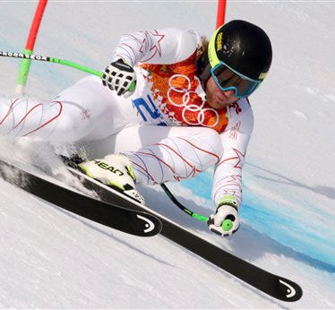 United States skier Andrew Weibrecht passes a gate on his way to winning the silver medal in the men's super-G at the Sochi 2014 Winter Olympics, Sunday, Feb. 16, 2014, in Krasnaya Polyana, Russia.