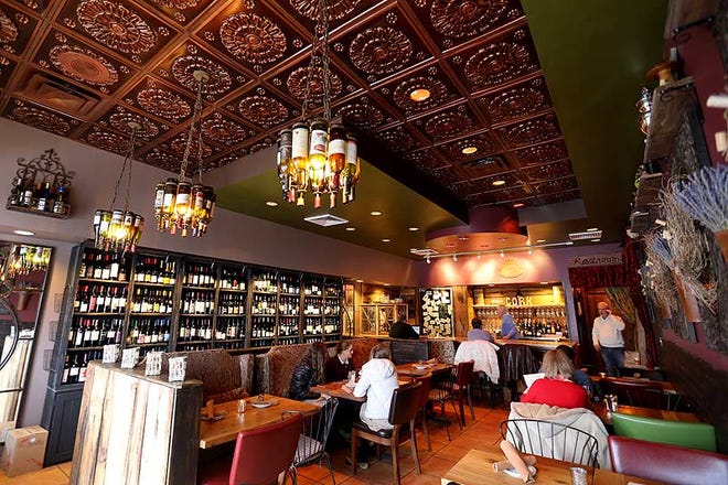 More than 150 wines are offered at Cork Wine and Dine, 4782 Morse Rd. on the Northeast Side, with bottles filling one wall of the renovated space. The place is designed to appeal to female customers.
