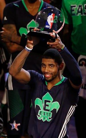 East Team's Kyrie Irving, of the Cleveland Cavaliers holds the All Star MVP trophy after the NBA All Star basketball game, Sunday, Feb. 16, 2014, in New Orleans.(AP Photo/Bill Haber)
