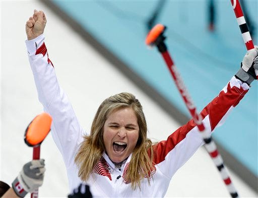 Canada’s skip Jennifer Jones celebrates after delivering the last rock during the women's curling semifinal game against Britain at the 2014 Winter Olympics, Wednesday, Feb. 19, 2014, in Sochi, Russia.