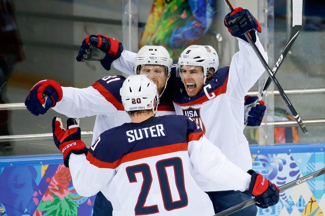 United States forward Zach Parise (right) celebrates with Phil Kessel (81) and Ryan Suter after scoring during the second period of the U.S.'s 5-2 win over the Czech Republic in a men's quarterfinal game at the Winter Olympics on Wednesday.
