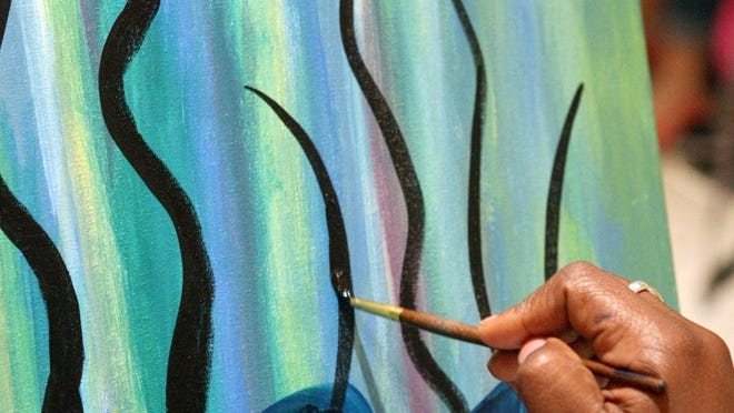 Uptown Art, in CityPlace in West Palm Beach, teaches people with no painting experience how to re-create a painting, brushstroke by brushstroke. (Jennifer Podis/The Palm Beach Post)