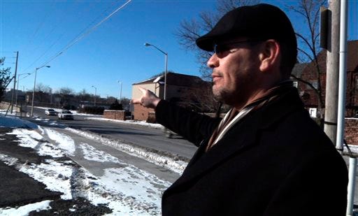In this image from a Jan. 29, 2014 video, Ricardo Nieves stands in a parking lot where he says he was stopped and motions in the direction he says he'd been driving from during the National Roadside Survey of Alcohol and Drugged Driving on Dec. 13, 2013 in Reading, Pa. Nieves filed a federal lawsuit over the survey, saying his rights were violated when a government contractor forced him into the parking lot, where he was questioned about his driving habits and asked to provide a saliva sample. (AP Photo/Michael Rubinkam)