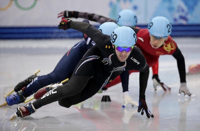 Chris Creveling of the United States leads the field in a men's 1000m short track speedskating quarterfinal at the Iceberg Skating Palace during the 2014 Winter Olympics, Saturday, Feb. 15, 2014, in Sochi, Russia. (AP Photo/Bernat Armangue)