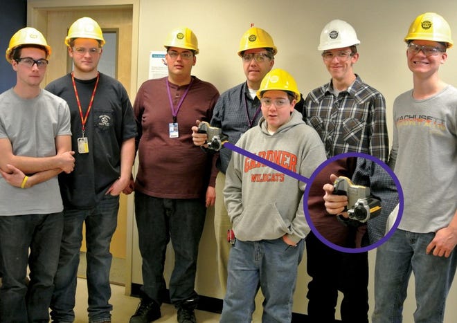 Monty Tech students and teacher worked on an insulation project at Sterling’s DPW building. Left to right: Tyler Favreau of Sterling, Robert Farren of Baldwinville, Jake Lawrence of Fitchburg, teacher Bill Stuessy, Chris LaBarge of Gardner, Brendan O’Rourke of Holden and Evan Halliday of Westminster. Also, photo enlargement of the infrared camera that Monty Tech purchased through a grant.