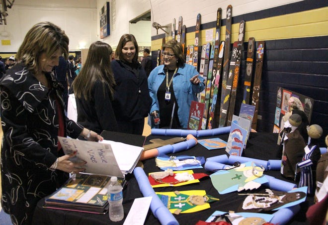 St. John the Evangelist School held a Showcase to celebrate 160 years in existence on Thursday evening at SJHS' gym. Above, patrons view material at the event. 
POST SOUTH PHOTO/Peter Silas Pasqua
