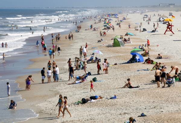 Beachgoers occupy St. Augustine Beach in July 2013.