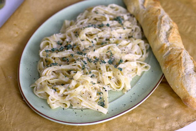 Fettuccini with garlic parmesan puree is a tasty weeknight meal. lN.H. (AP Photo/Matthew Mead)