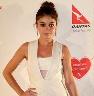 Sarah Hyland who plays Haley Dunphy from the U.S. TV series Modern Family arrives on the red carpet during a social event in Sydney, Australia, Thursday, Feb. 20, 2014. The series cast are in Sydney to shoot the Australian episodes. (AP Photo/Rob Griffith)