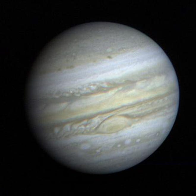 The planet Jupiter shines brilliantly in the night sky due to reflected sunlight and its sheer size. NASA