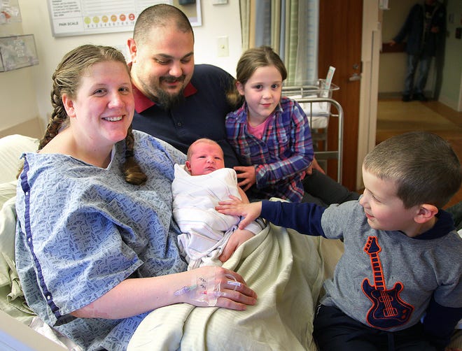 Ethan Long was born Friday morning in the family vehicle at the Hanover Mall to Chris and Samantha Long of Pembroke. Two of Ethan's siblings, Cassandra, 6, and Michael, 4½, met their new brother at South Shore Hospital later in the day. The photo was taken on Friday, Feb. 21, 2014.