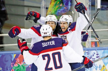 USA forward Zach Parise (right) celebrates with teammates Phil Kessel (81) and Ryan Suter after scoring a goal during Wednesday’s quarterfinal win over the Czech Republic. The U.S. plays Canada today in the semifinals.