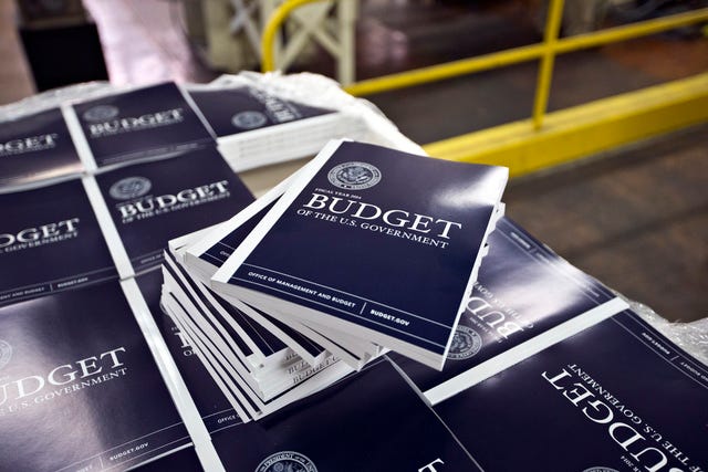 ASSOCIATED PRESS FILE PHOTO / Copies of President Barack Obama's budget plan for fiscal year 2014 are prepared for delivery at the U.S. Government Printing Office in Washington on April 8, 2013.