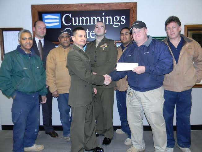 Cummings Center staff presented checks totaling $5,000 for Beverly High School’s Marine Junior R.O.T.C. program. Pictured, left to right, are Bolivar Duran, Steve Drohosky, Jose Fana, R.O.T.C. chief warrant officer Tom Smith, Beverly High School senior and R.O.T.C. captain James Ryan, Abe Rivera, Beverly resident Bill Center and Beverly resident Bob McPhail. COURTESY PHOTO