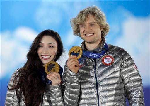 Ice dance figure skating gold medalists Meryl Davis and Charlie White of the United States pose with their medals at the 2014 Winter Olympics, Tuesday, Feb. 18, 2014, in Sochi, Russia.