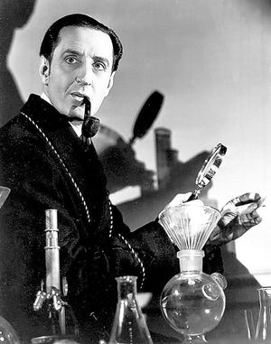 Actor Basil Rathbone is shown as Sherlock Holmes in the 1939 Hollywood movie, “The Hound of the Baskervilles.”