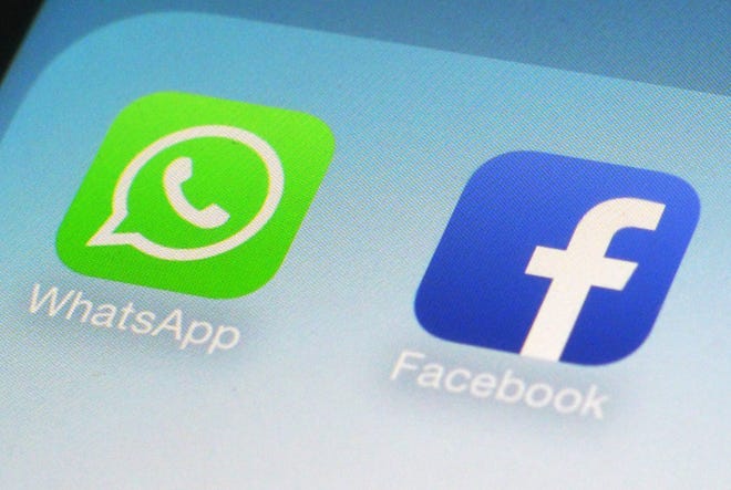 AP photo

The WhatsApp and Facebook app icons on an iPhone. On Wednesday, the world's biggest social networking company announced it is buying mobile messaging service WhatsApp for up to $19 billion in cash and stock.