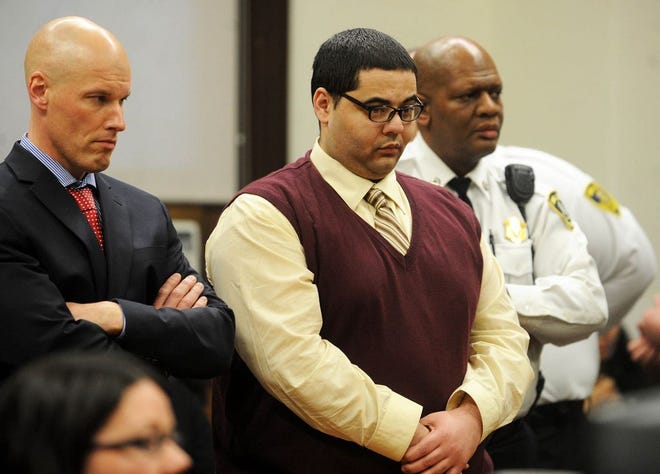 Michael Barros listens as the verdict is read at his murder trial in Brockton Superior Court on Friday, Feb. 21, 2014.