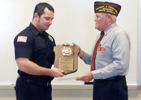 Havelock firefighter Charles Winter, left, receives the VFW National Firefighter Award from Thomas Toler, fourth district commander of the VFW, recently.